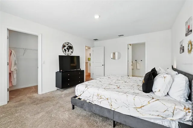 a bathroom with a double vanity sink mirror and shower