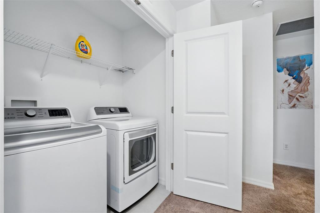 1421 Discovery Street Davenport, FL 33896 - Photo 31 of 44 a utility room with dryer and washer