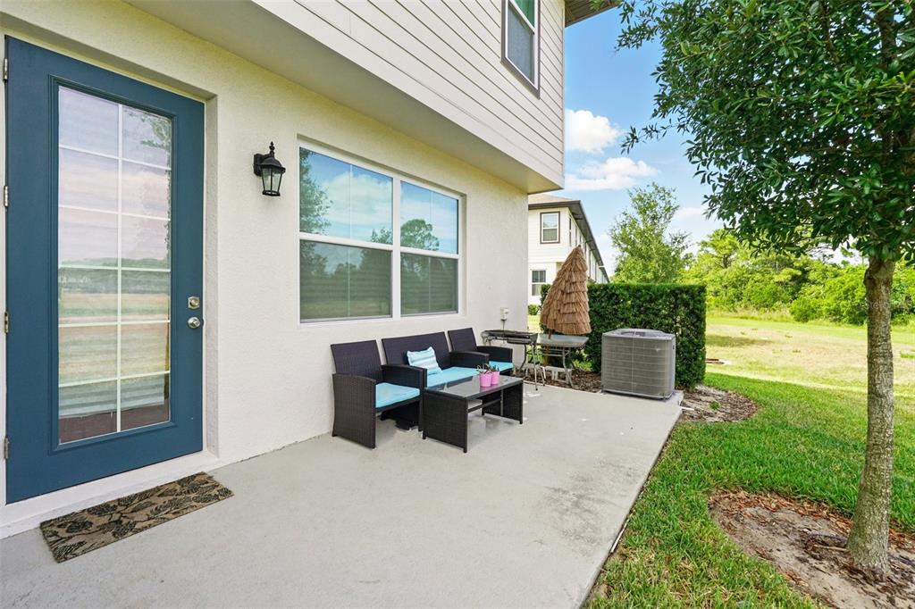 1421 Discovery Street Davenport, FL 33896 - Photo 34 of 44 a building outdoor space with patio furniture