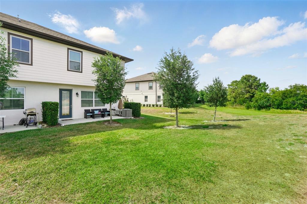 1421 Discovery Street Davenport, FL 33896 - Photo 36 of 44 a view of a house with a backyard