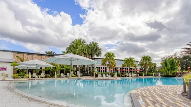 a view of a swimming pool with a patio