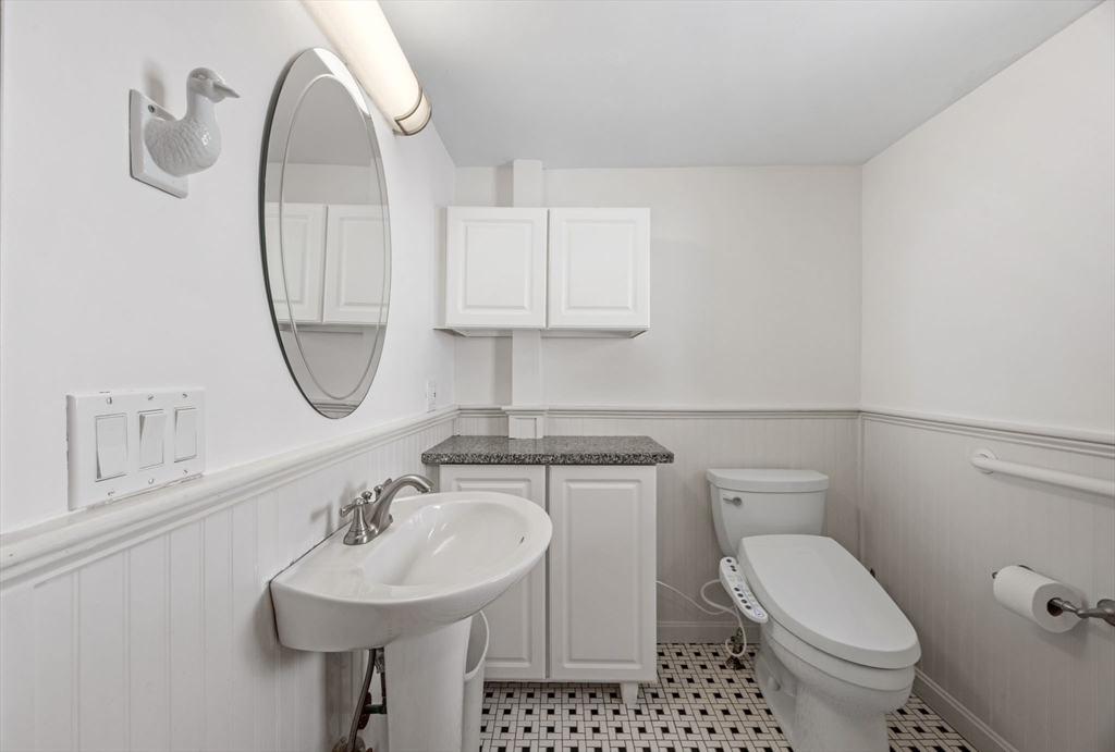 7 Grove Street Wareham, MA 02558 - Photo 18 of 41 a bathroom with a sink toilet and a mirror
