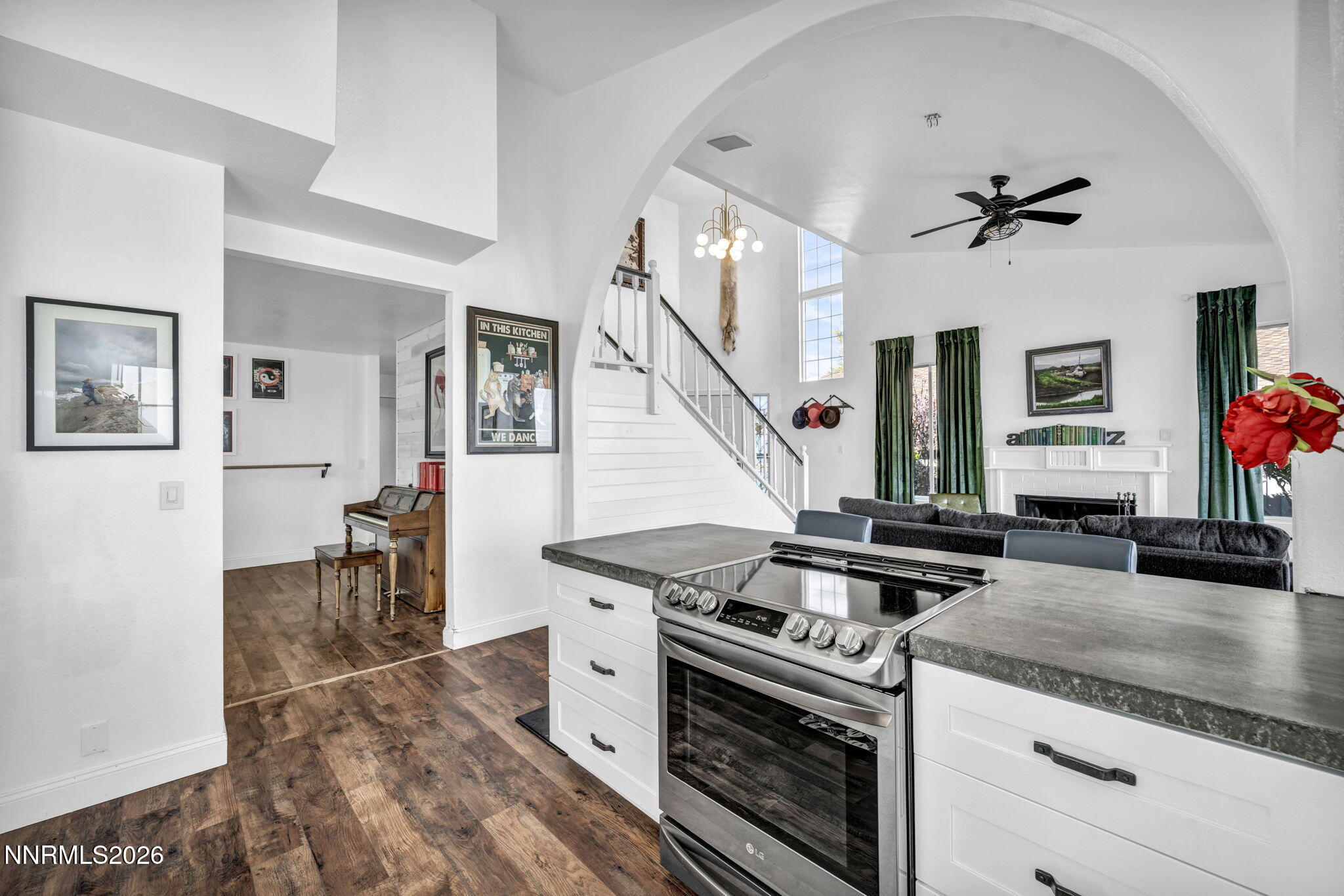 3332 Skyline View Drive Reno, NV 89509 - Photo 16 of 48 a kitchen with granite countertop a stove a sink and a dining table