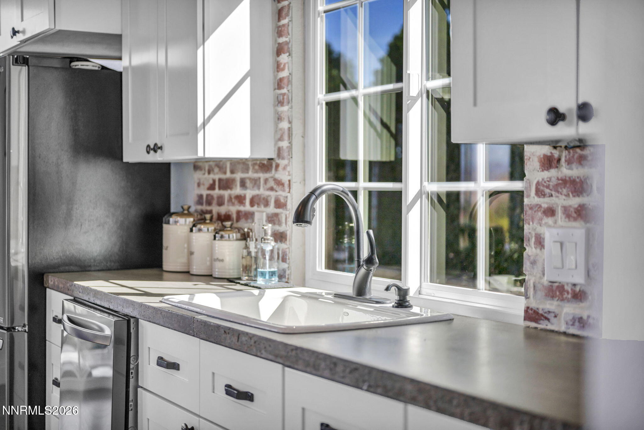 3332 Skyline View Drive Reno, NV 89509 - Photo 19 of 48 a kitchen with granite countertop a sink and a window
