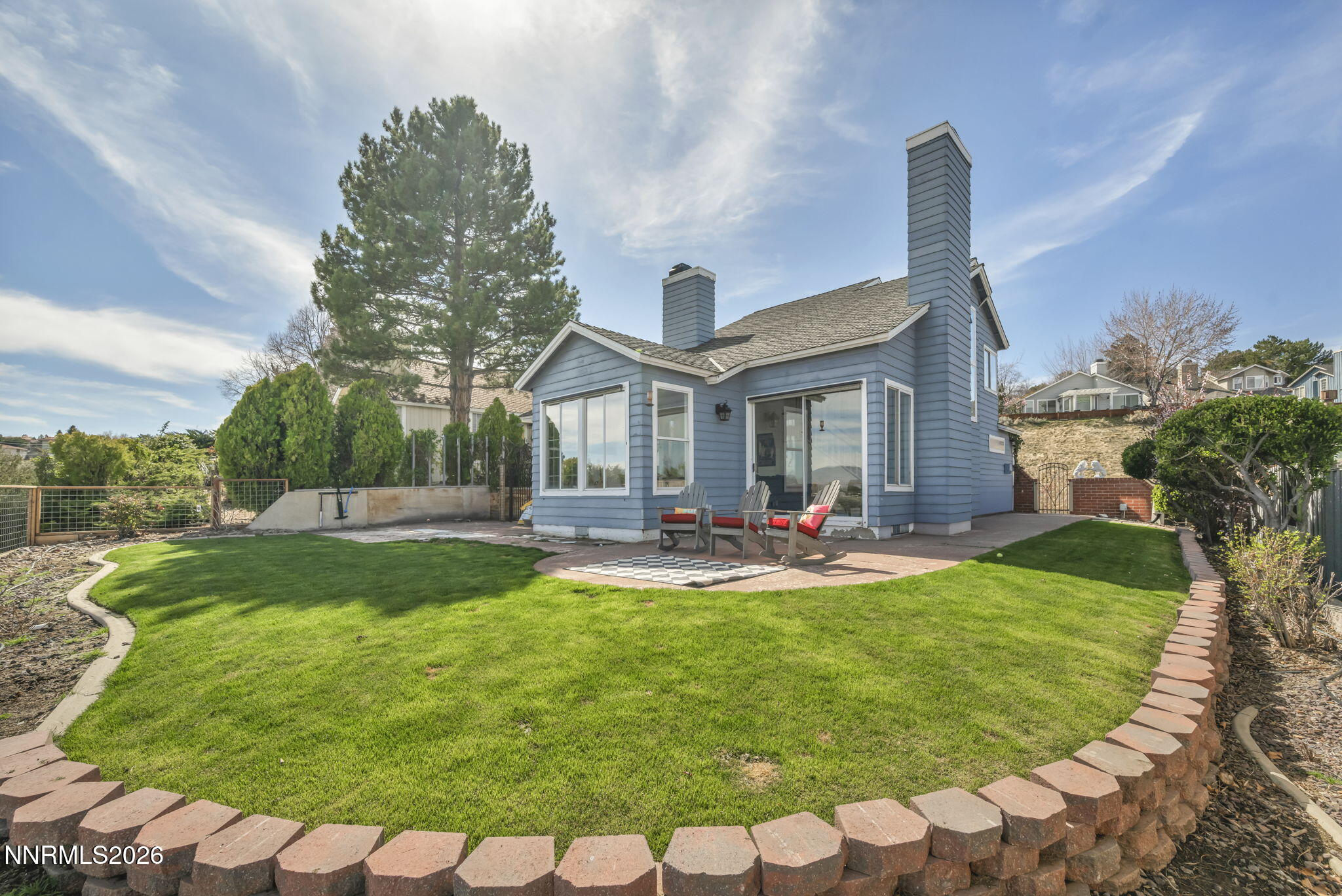 3332 Skyline View Drive Reno, NV 89509 - Photo 2 of 48 a front view of a house with swimming pool having outdoor seating