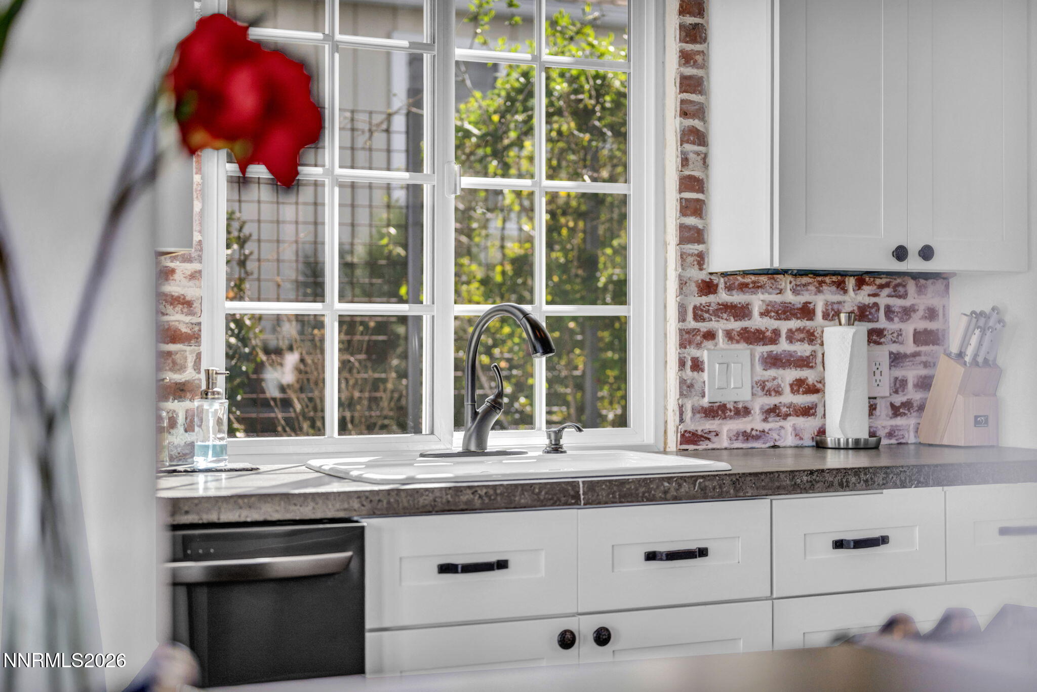 3332 Skyline View Drive Reno, NV 89509 - Photo 22 of 48 a kitchen with granite countertop a stove and a sink