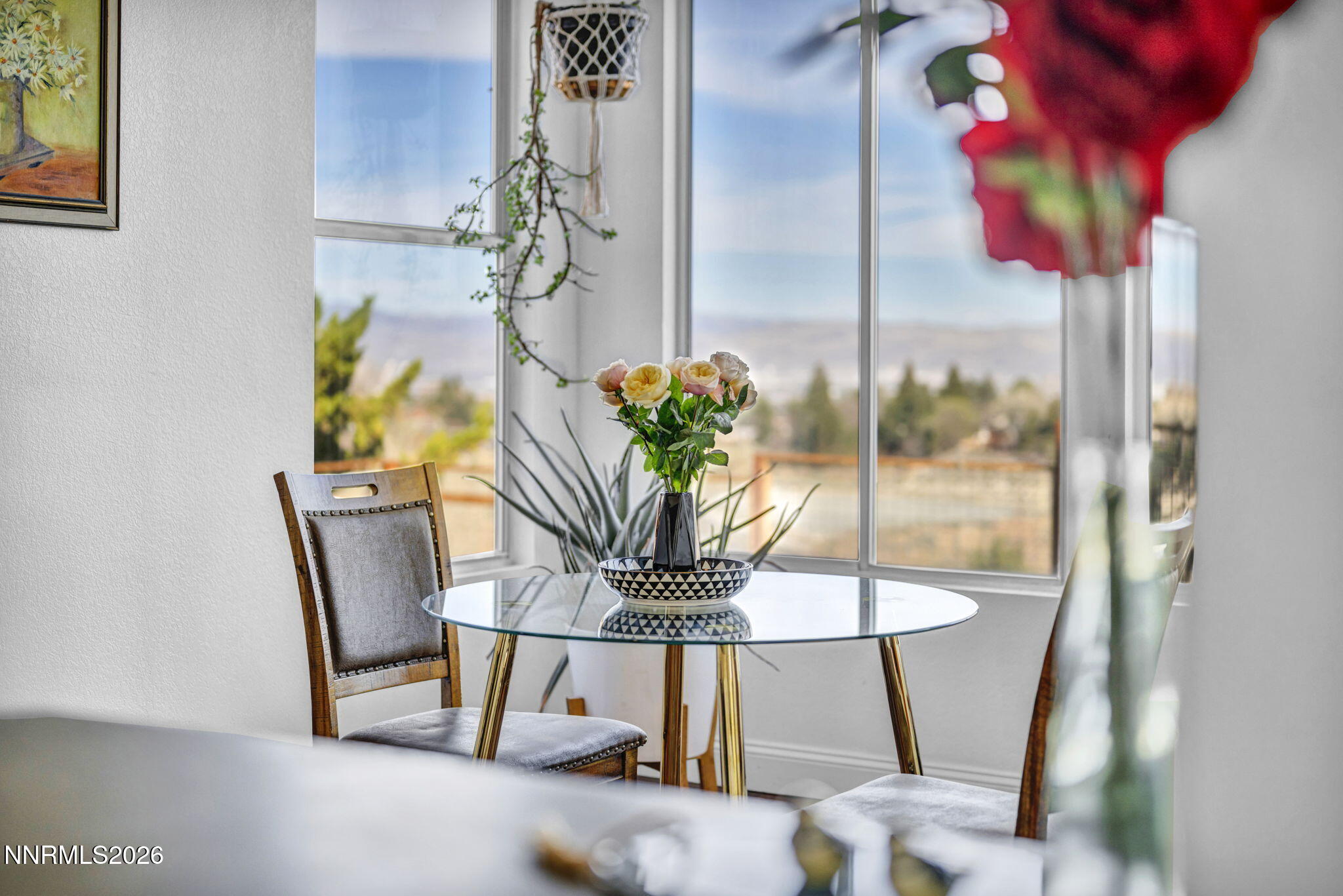 3332 Skyline View Drive Reno, NV 89509 - Photo 28 of 48 a vase of flowers sitting on a table with a mirror