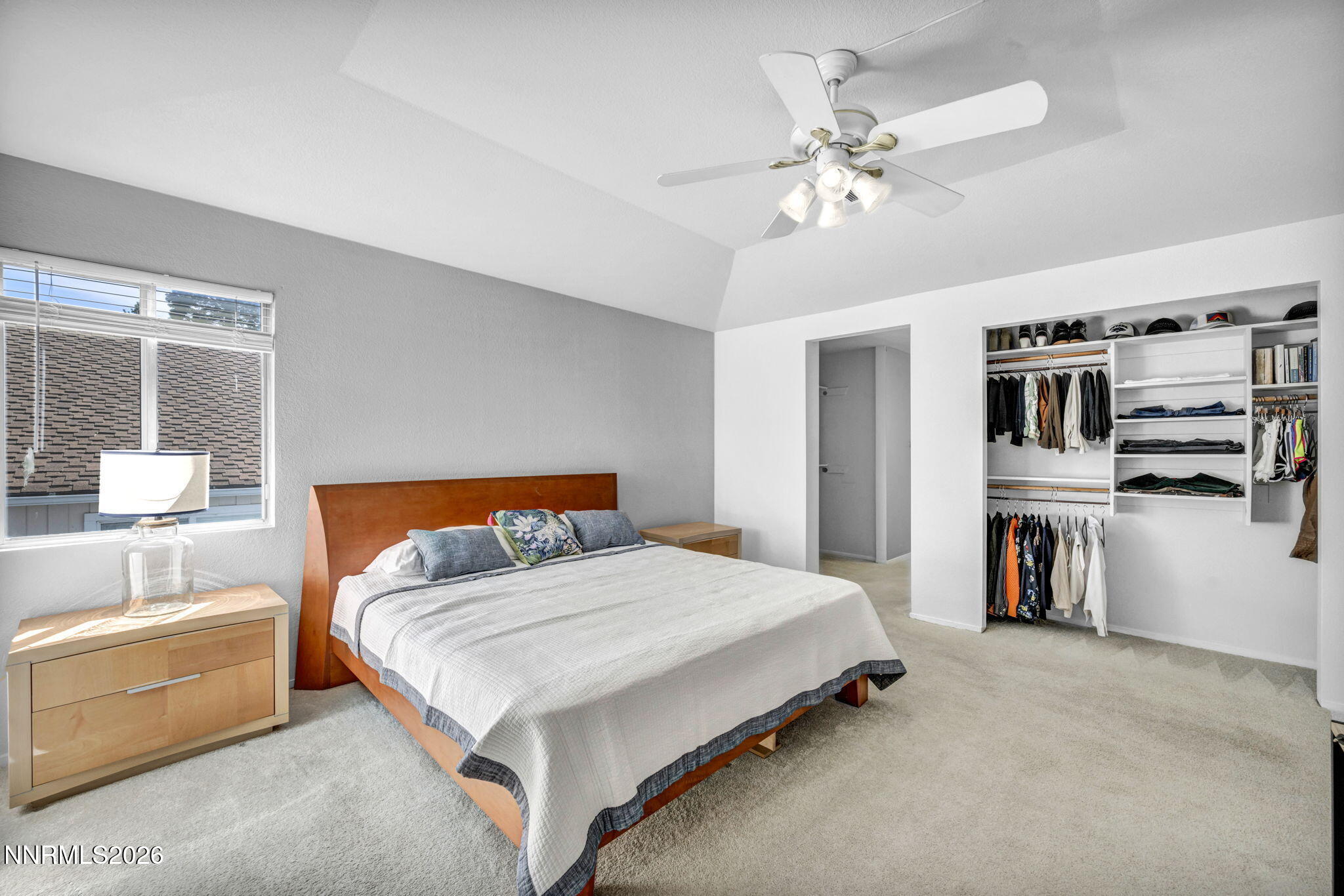 3332 Skyline View Drive Reno, NV 89509 - Photo 33 of 48 a bedroom with a large bed and a chandelier