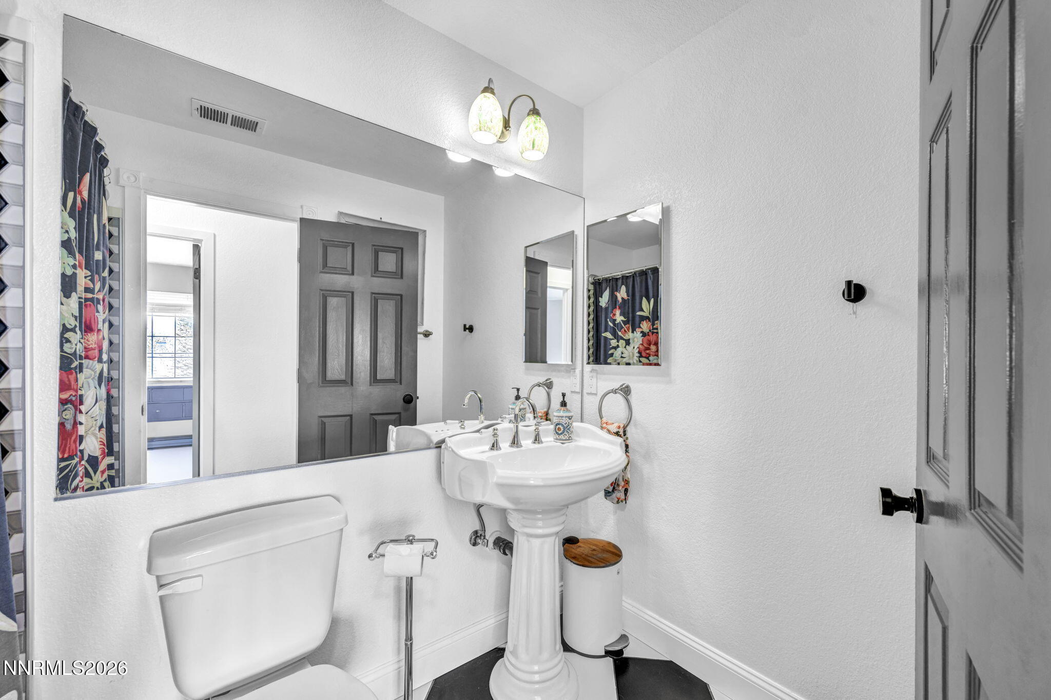 3332 Skyline View Drive Reno, NV 89509 - Photo 39 of 48 a bathroom with a sink and a mirror