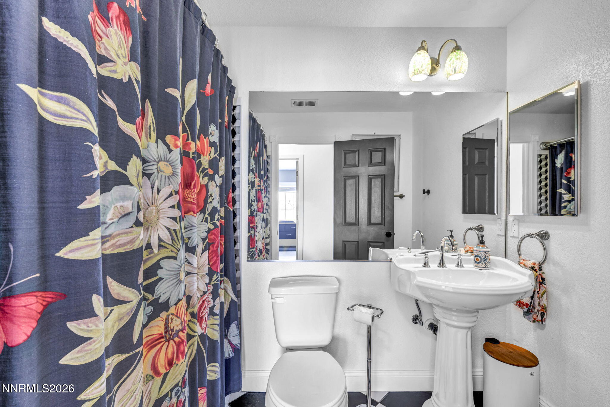 3332 Skyline View Drive Reno, NV 89509 - Photo 40 of 48 a bathroom with a sink and mirror with toilet