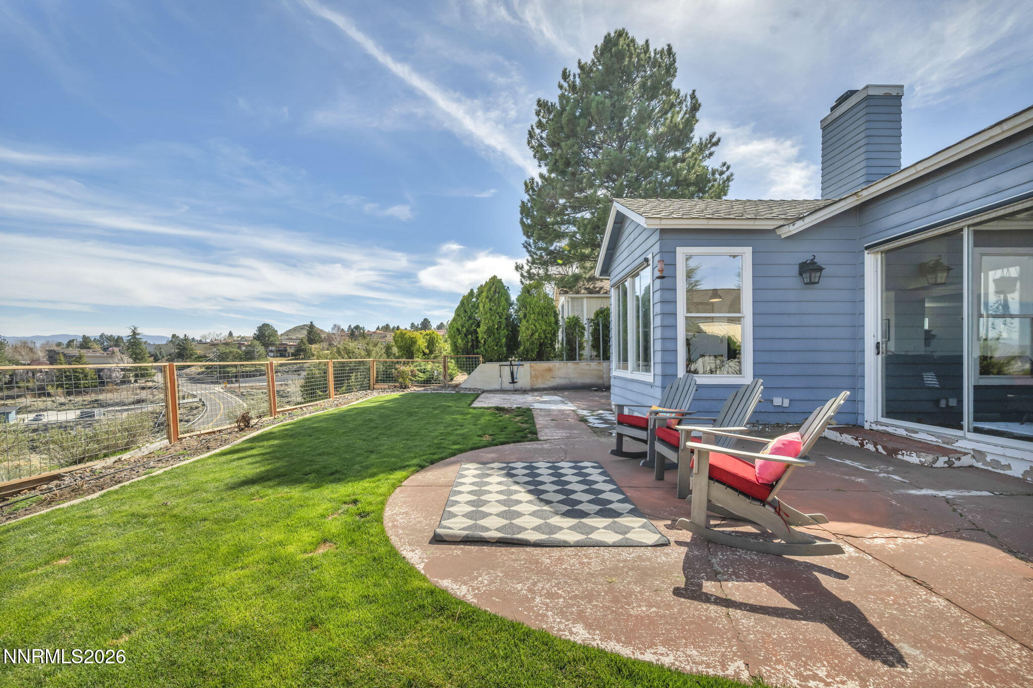 3332 Skyline View Drive Reno, NV 89509 - Photo 44 of 48 a bench sitting in the grass near a yard