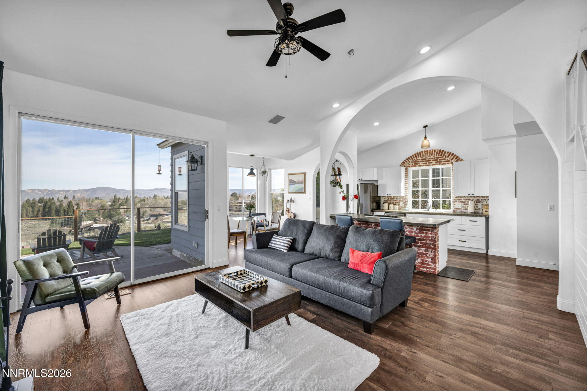 3332 Skyline View Drive Reno, NV 89509 - Photo 7 of 48 a living room with furniture a rug and a chandelier