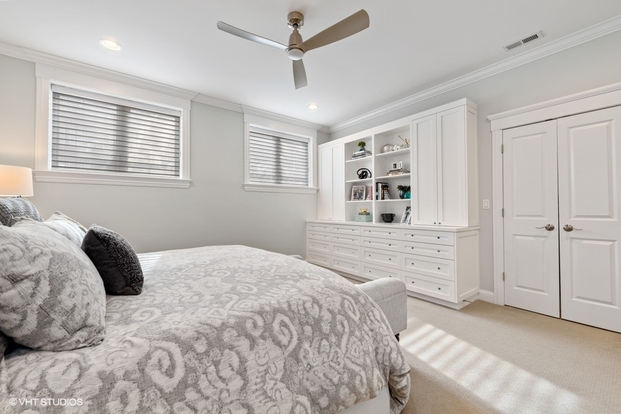 1248 West Grace Street, Unit 1 Chicago, IL 60613 - Photo 21 of 35 a bedroom with a bed a dresser and a window