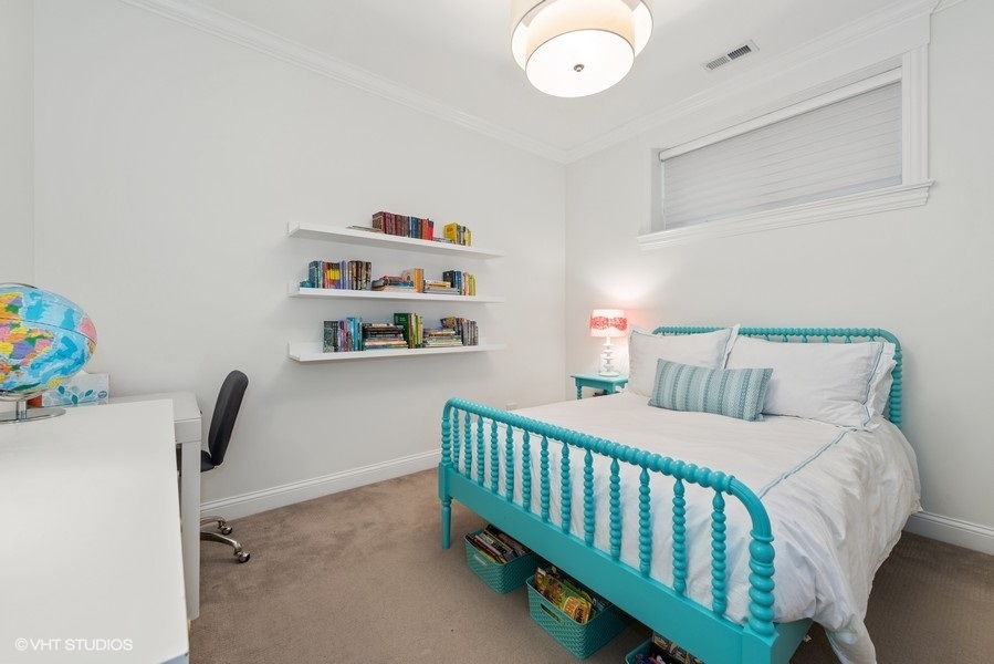 1248 West Grace Street, Unit 1 Chicago, IL 60613 - Photo 28 of 35 a bedroom with a bed and with furniture