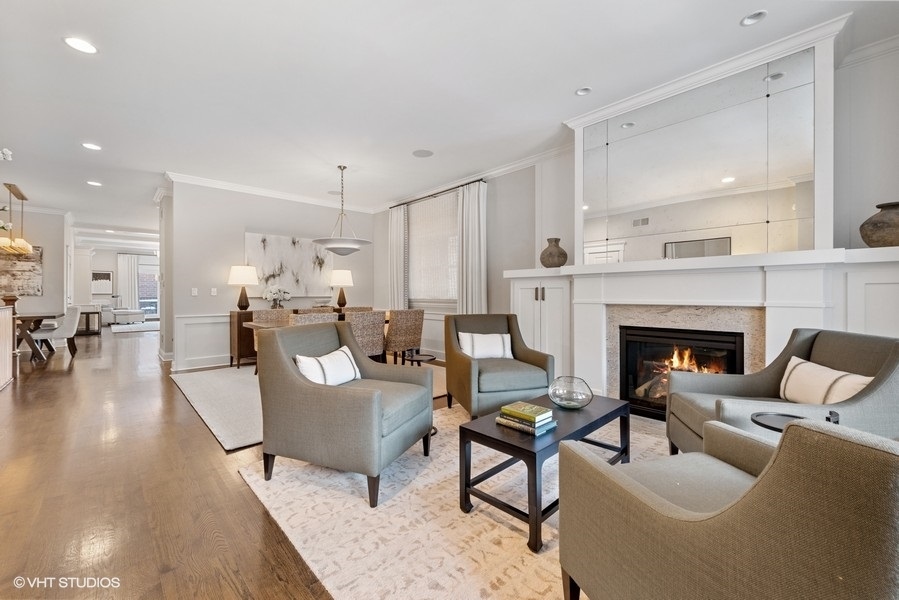 1248 West Grace Street, Unit 1 Chicago, IL 60613 - Photo 3 of 35 a living room with furniture and a fireplace