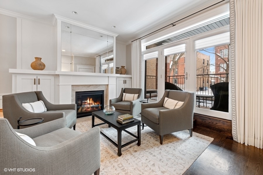 1248 West Grace Street, Unit 1 Chicago, IL 60613 - Photo 6 of 35 a living room with furniture and a fireplace