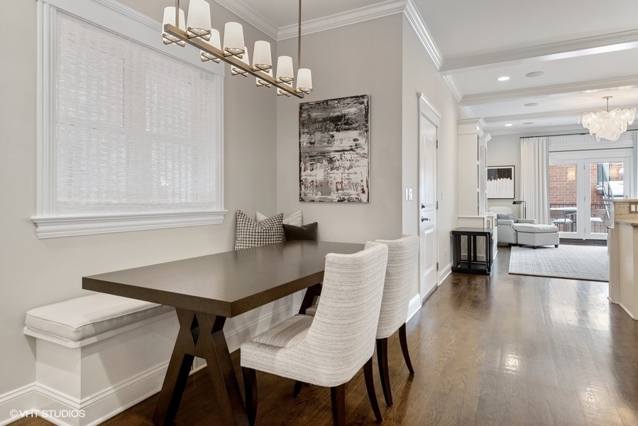 1248 West Grace Street, Unit 1 Chicago, IL 60613 - Photo 9 of 35 a view of a dining room with furniture and wooden floor