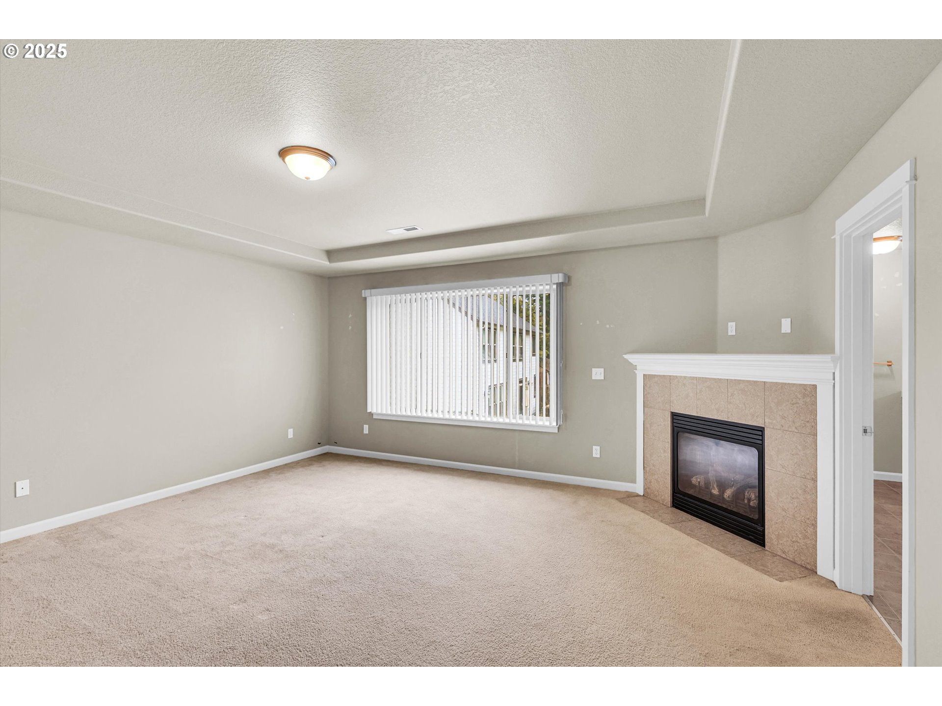 1892 Southwest Willowview Terrace Beaverton, OR 97003 - Photo 30 of 48 a view of an empty room with a window and fireplace