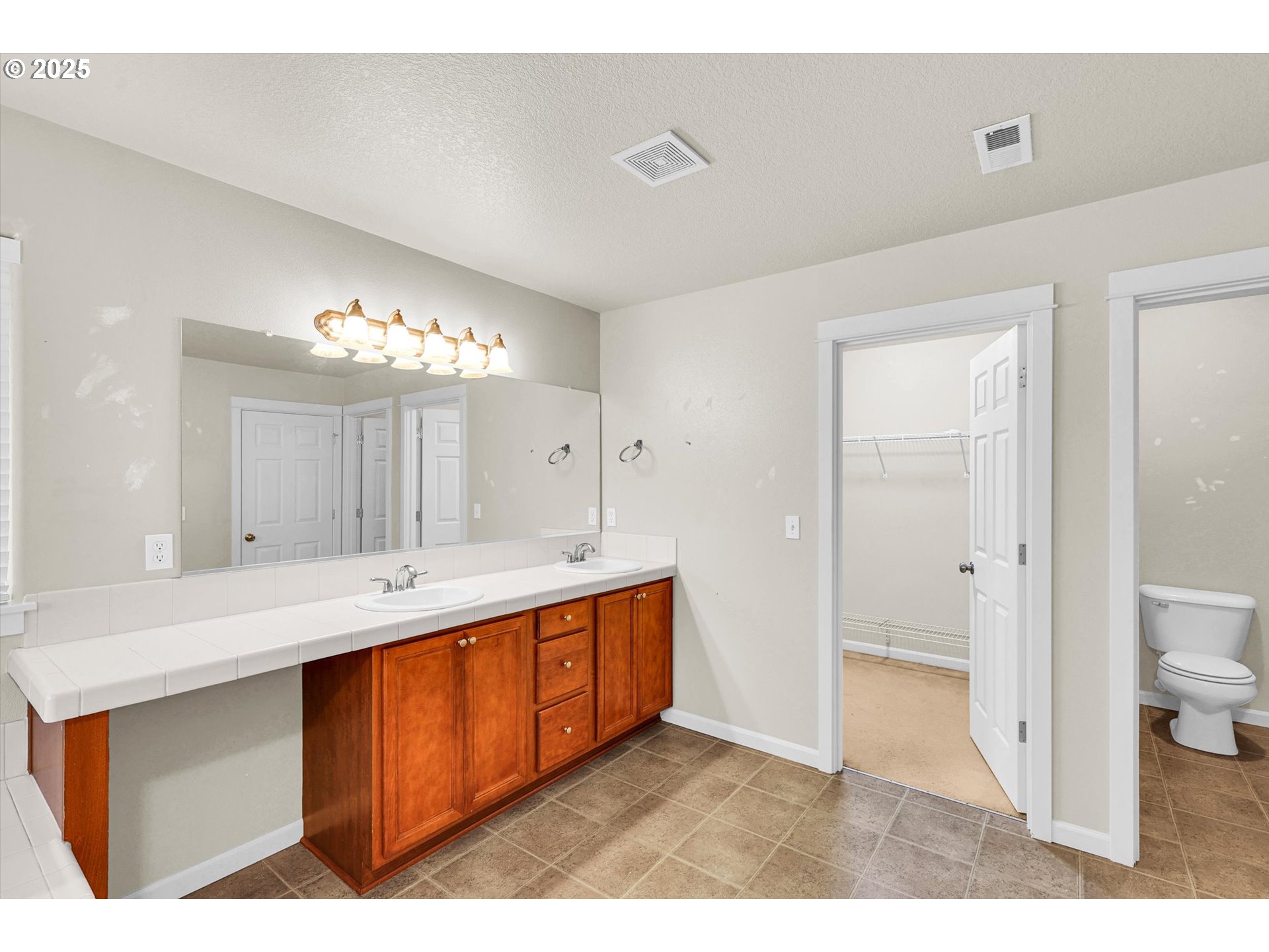 1892 Southwest Willowview Terrace Beaverton, OR 97003 - Photo 35 of 48 a bathroom with a sink double vanity granite and a mirror