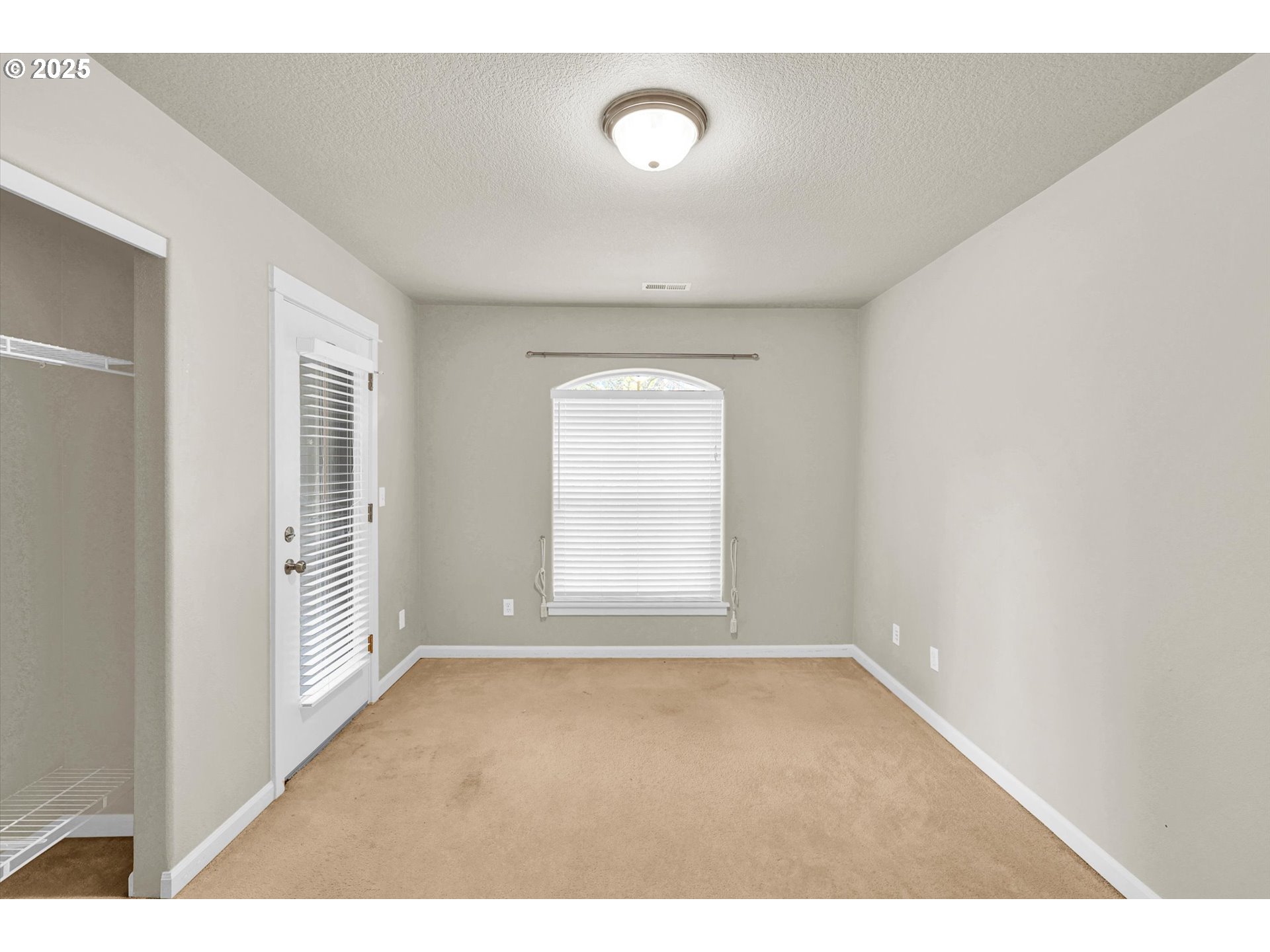 1892 Southwest Willowview Terrace Beaverton, OR 97003 - Photo 37 of 48 a view of an empty room with a window