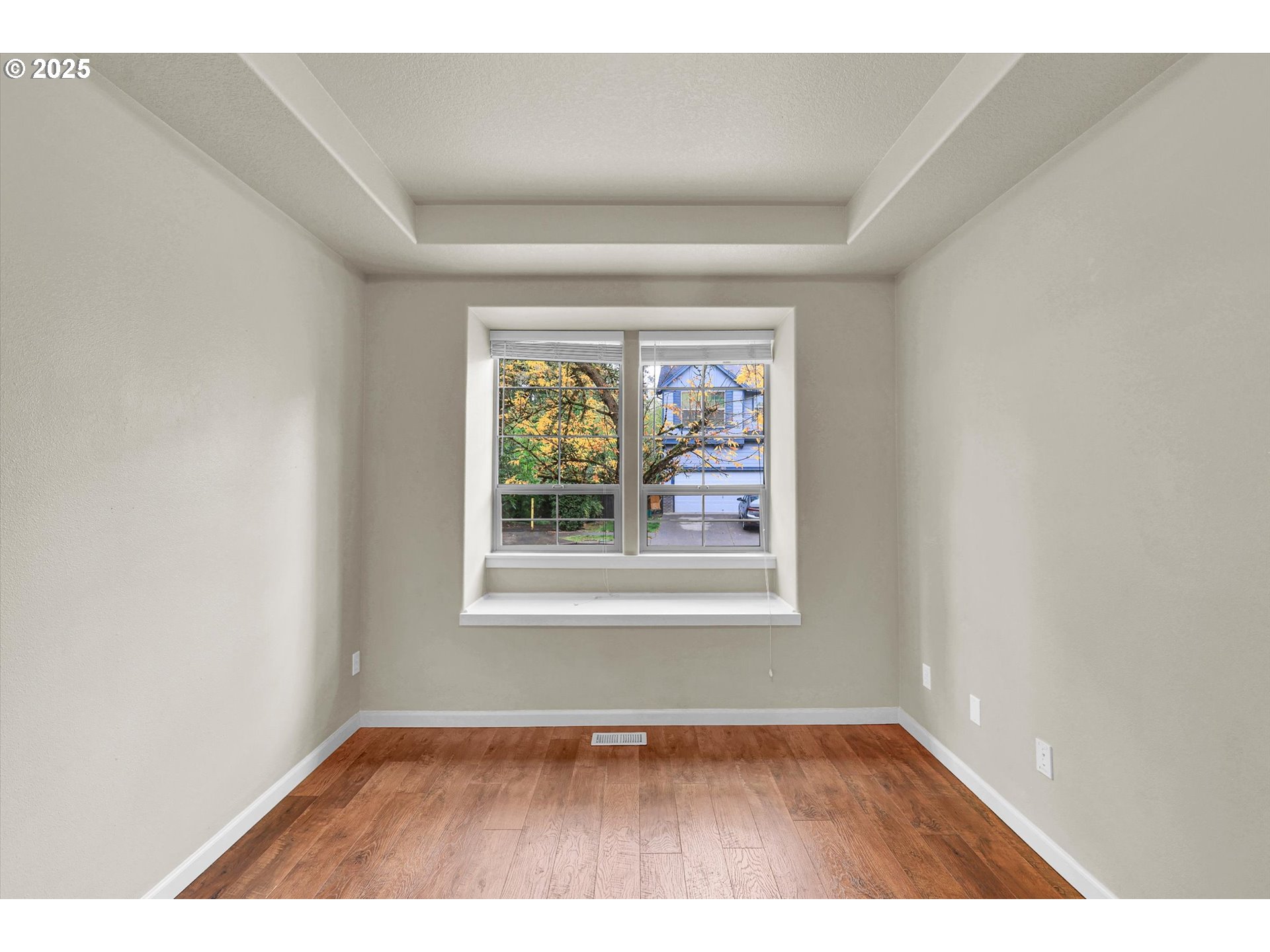 1892 Southwest Willowview Terrace Beaverton, OR 97003 - Photo 10 of 48 an empty room with wooden floor and windows
