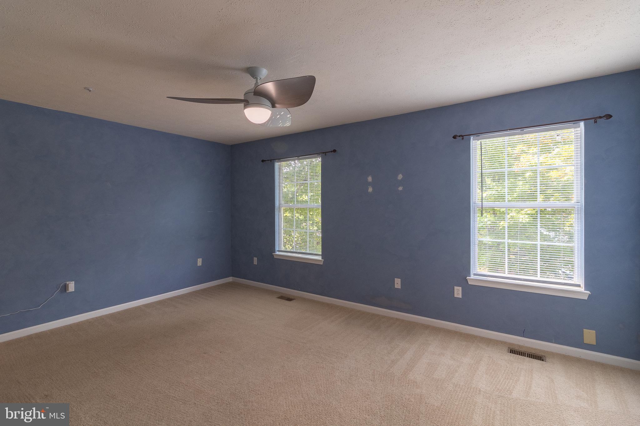 45292 Rumsford Lane California, MD 20619 - Photo 12 of 18 an empty room with a window and ceiling fan