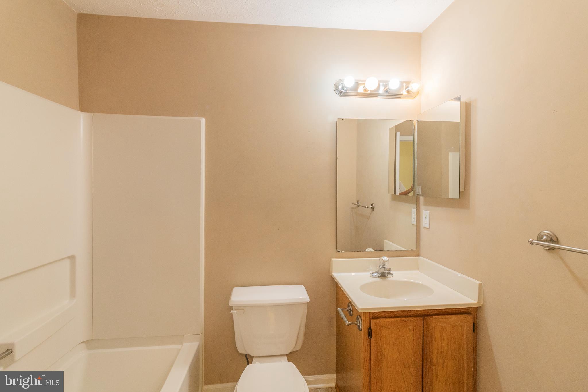 45292 Rumsford Lane California, MD 20619 - Photo 13 of 18 a bathroom with a sink and a mirror