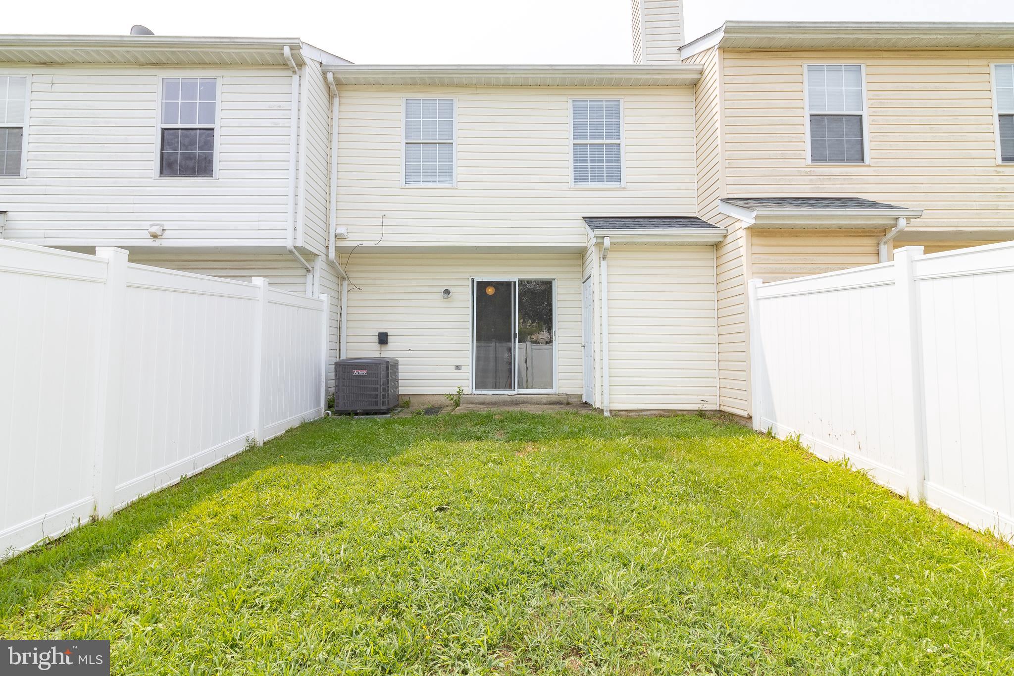 45292 Rumsford Lane California, MD 20619 - Photo 18 of 18 a view of a backyard with a garden