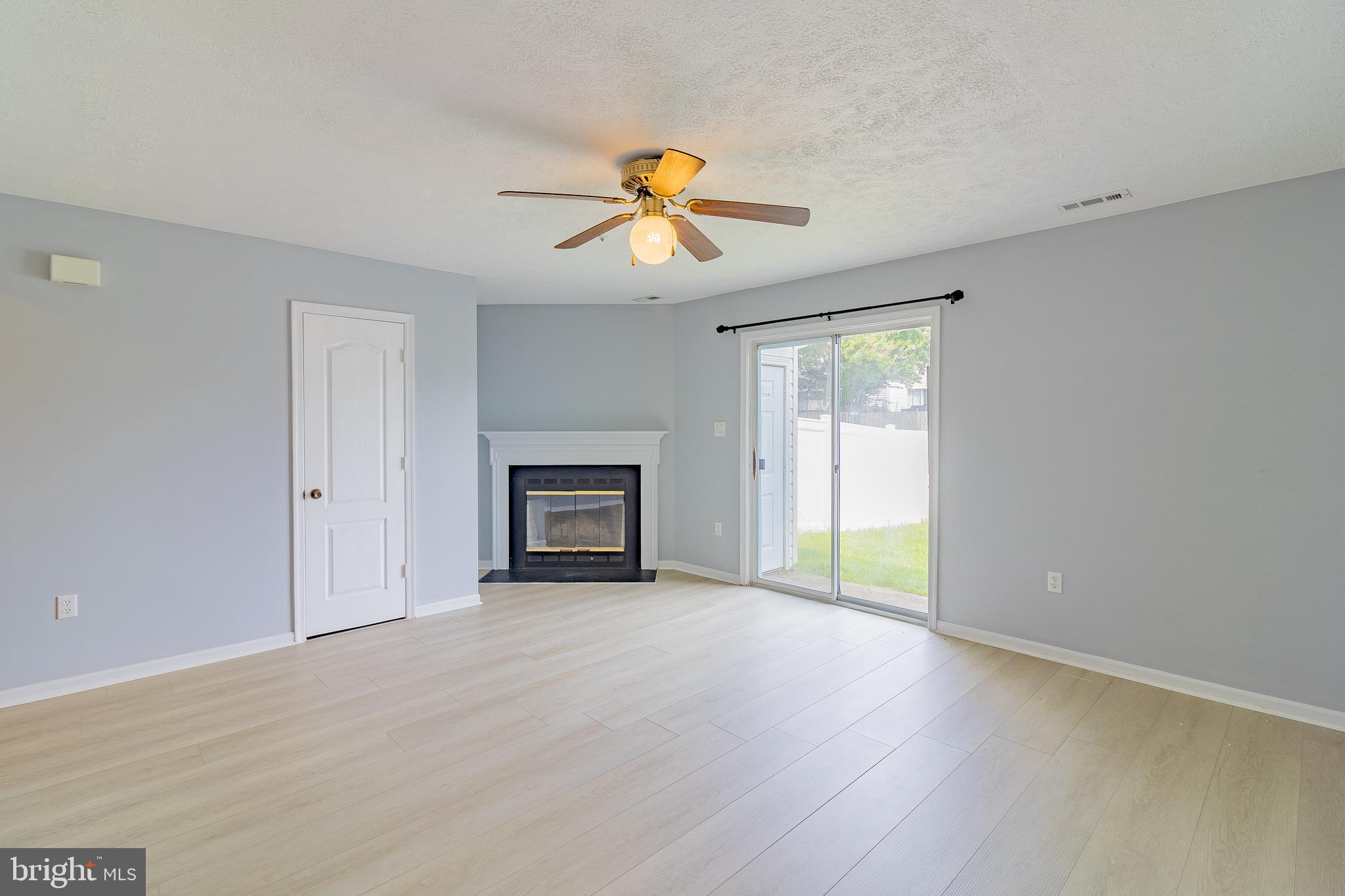 45292 Rumsford Lane California, MD 20619 - Photo 3 of 18 a view of empty room with wooden floor and fan