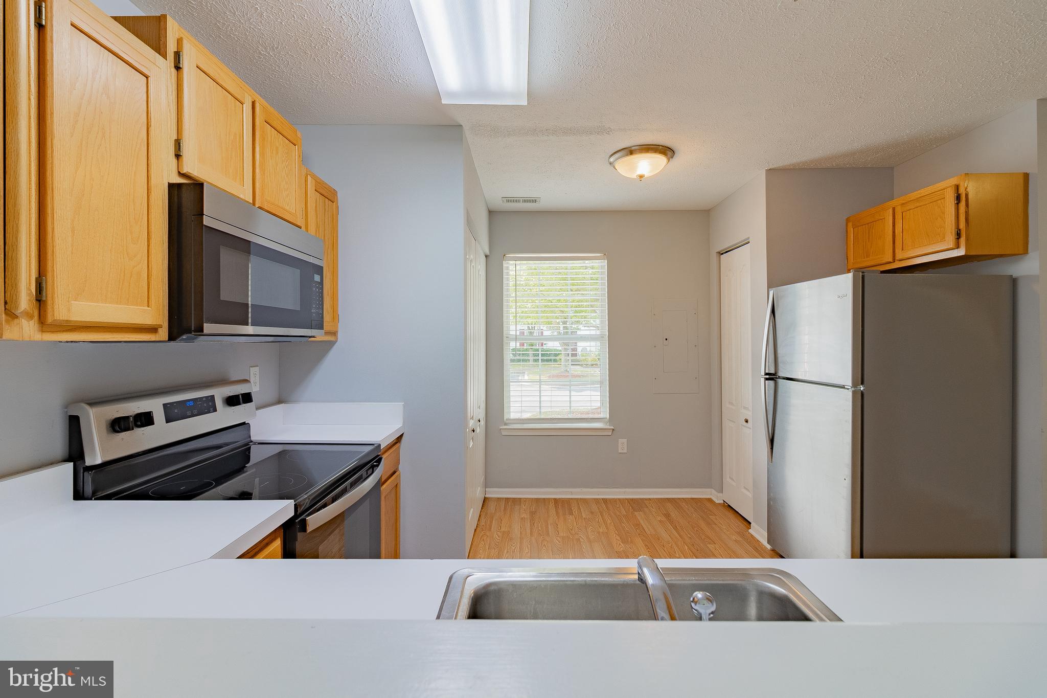 45292 Rumsford Lane California, MD 20619 - Photo 7 of 18 a room with storage and utility