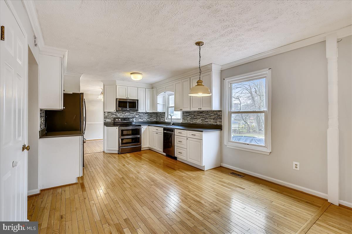 14904 Windmill Terrace Silver Spring, MD 20905 - Photo 22 of 80 View from Family Room into Kitchen