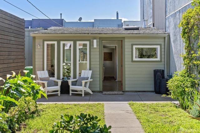 a view of a house with porch and sitting area