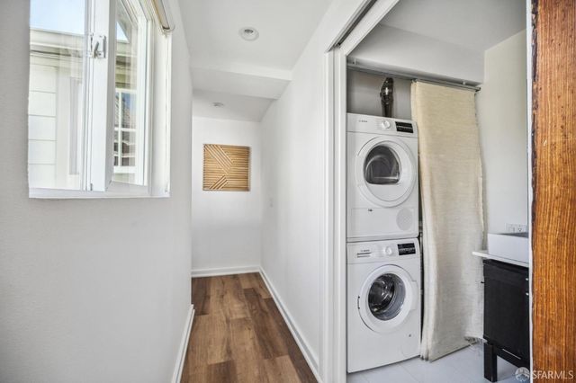 a view of a hallway with washer and dryer