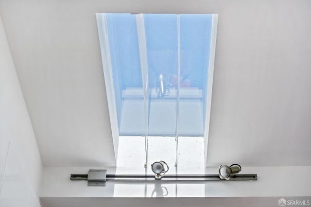 a view of living room with a window and flowerpot