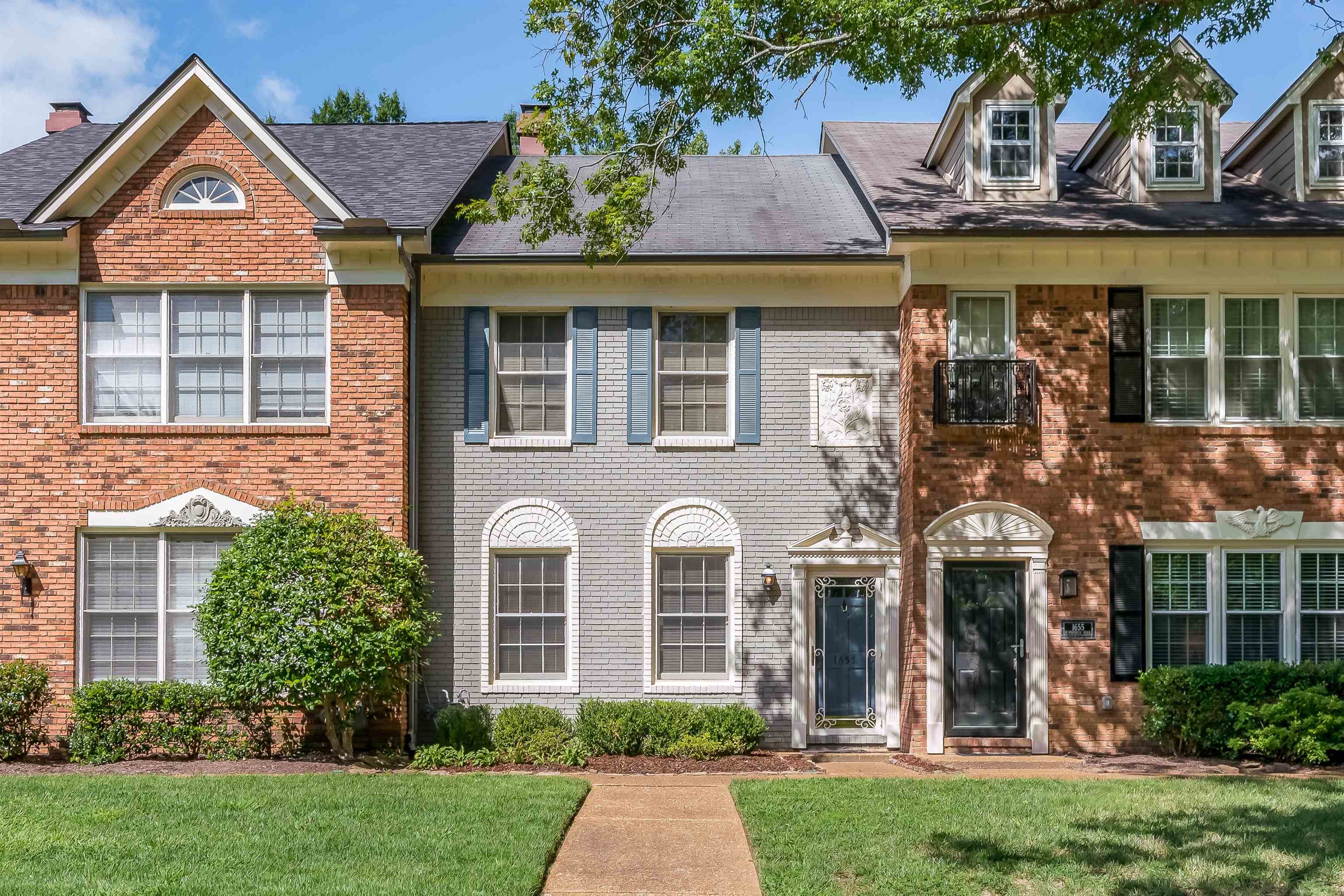 1657 Kimbrough Road, Unit 1657 Germantown, TN 38138 - Photo 1 of 25 front view of a house with a yard