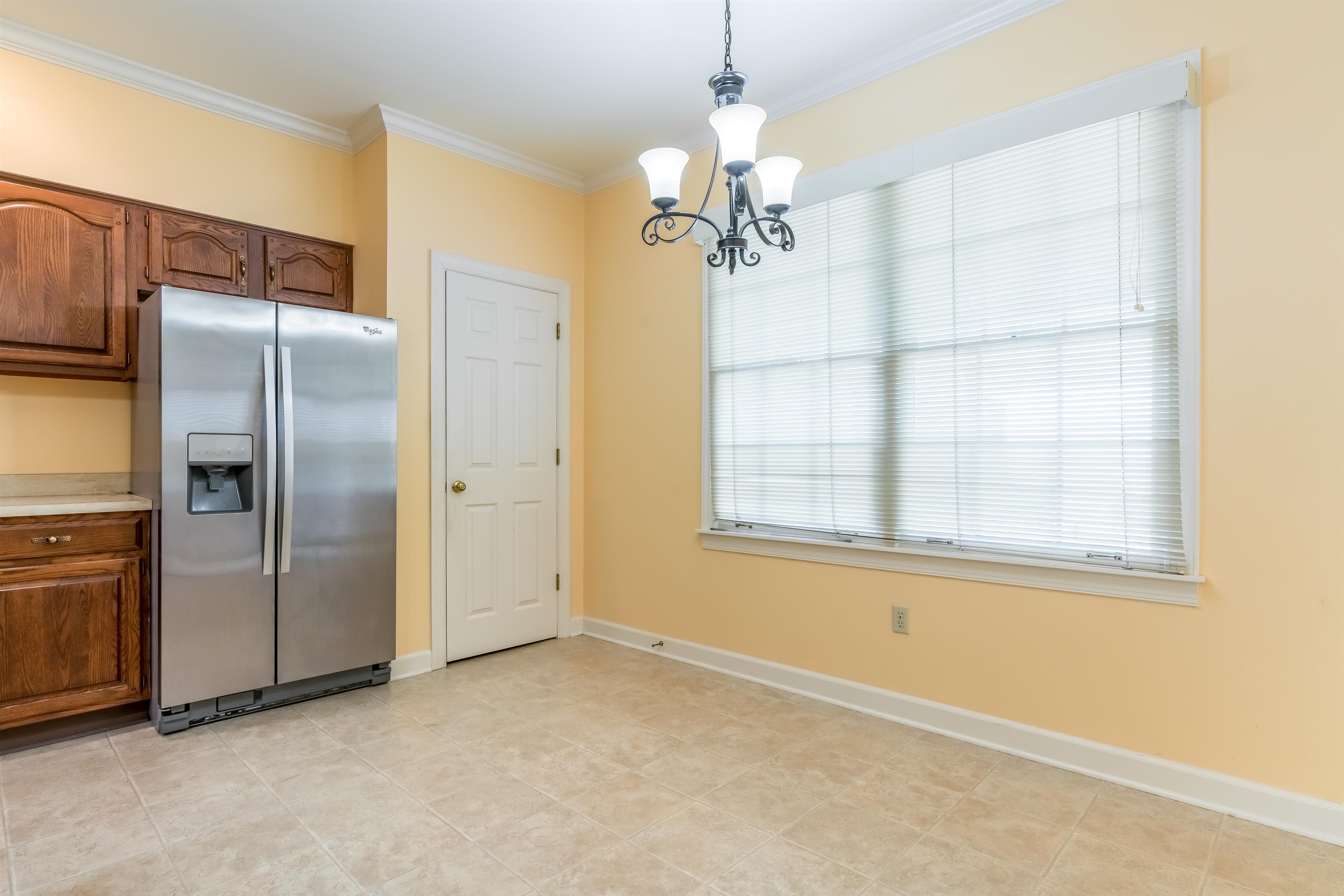 1657 Kimbrough Road, Unit 1657 Germantown, TN 38138 - Photo 14 of 25 an empty room with a windows and chandelier