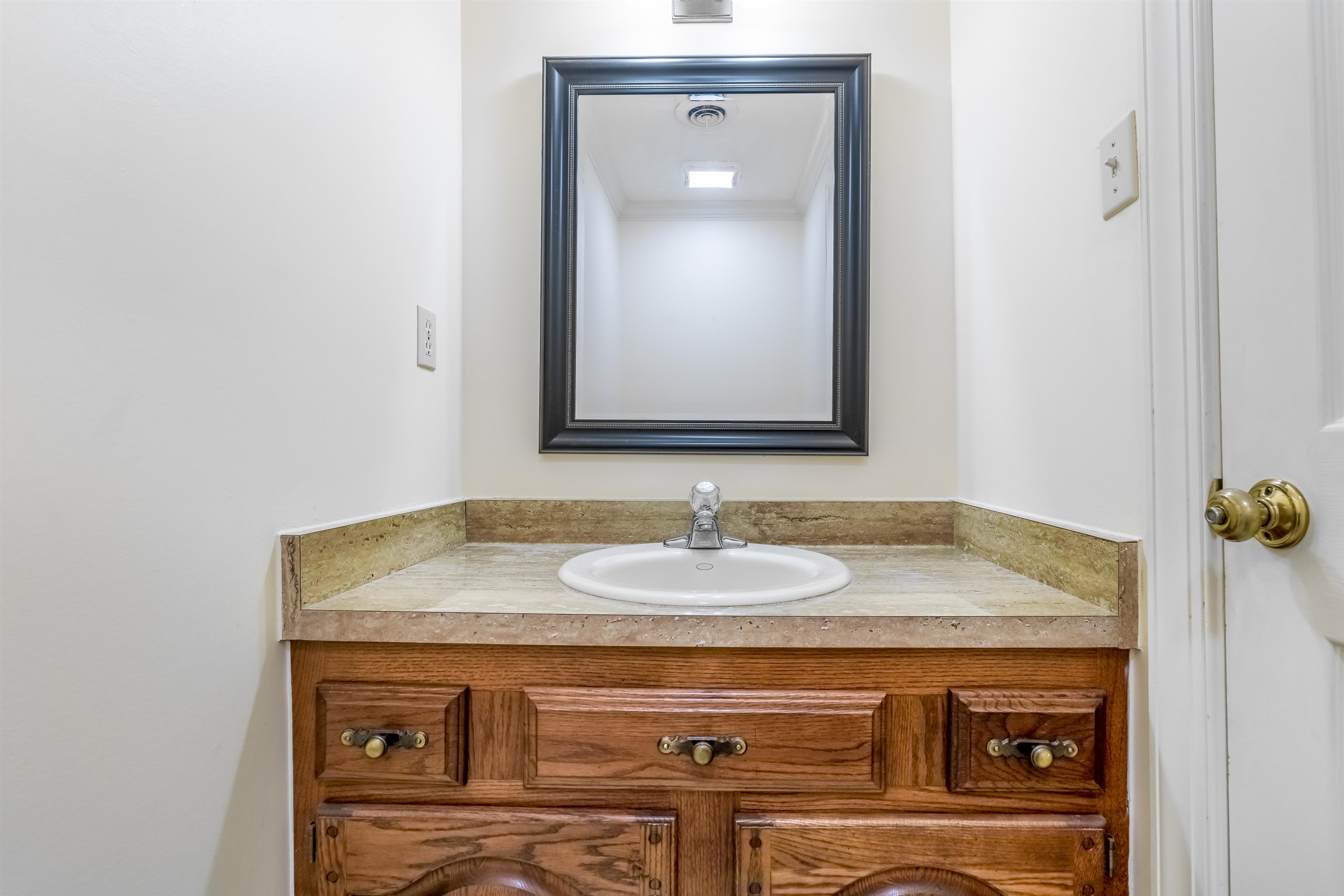 1657 Kimbrough Road, Unit 1657 Germantown, TN 38138 - Photo 15 of 25 a bathroom with a sink and a mirror