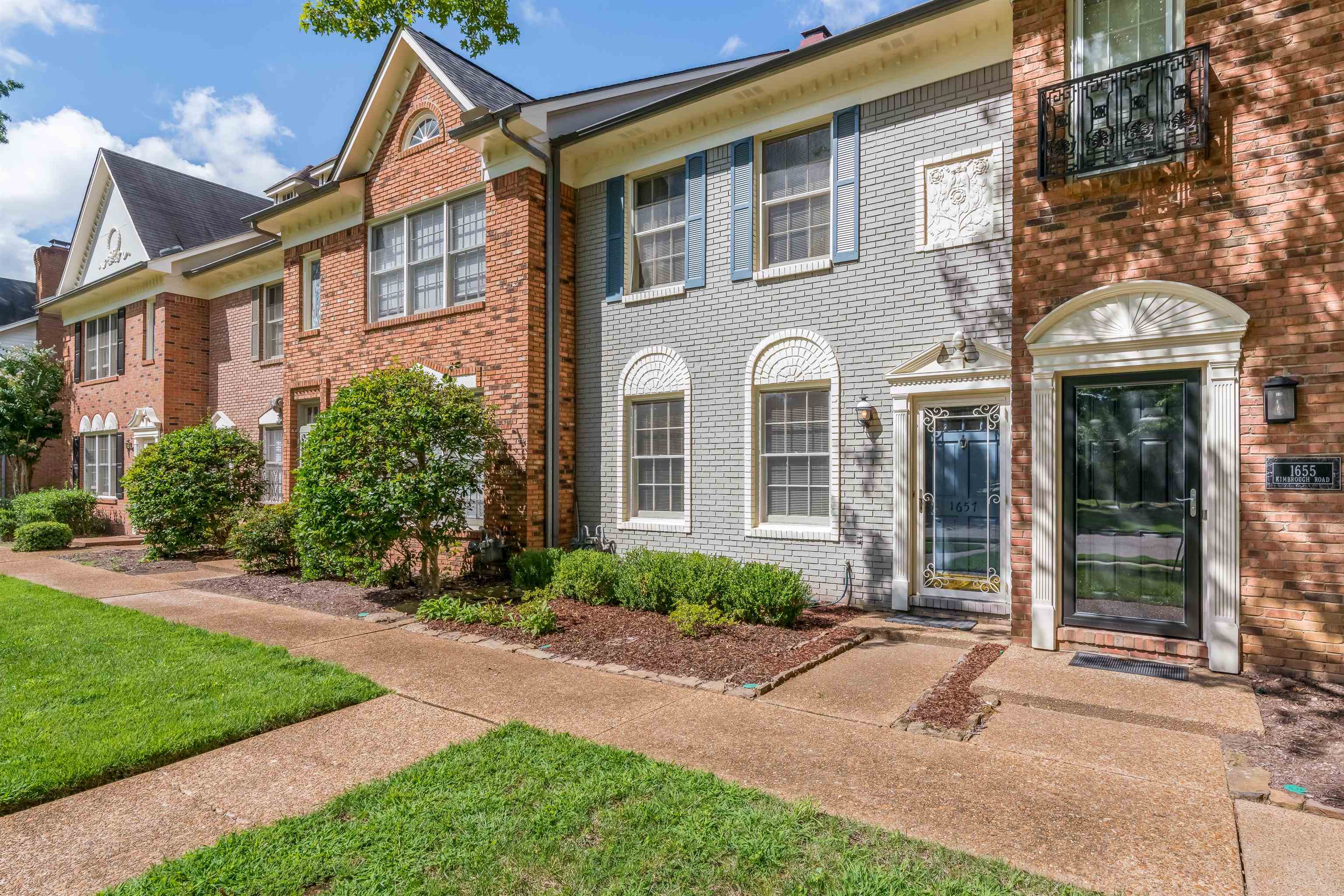 1657 Kimbrough Road, Unit 1657 Germantown, TN 38138 - Photo 2 of 25 a front view of a house with a yard and porch