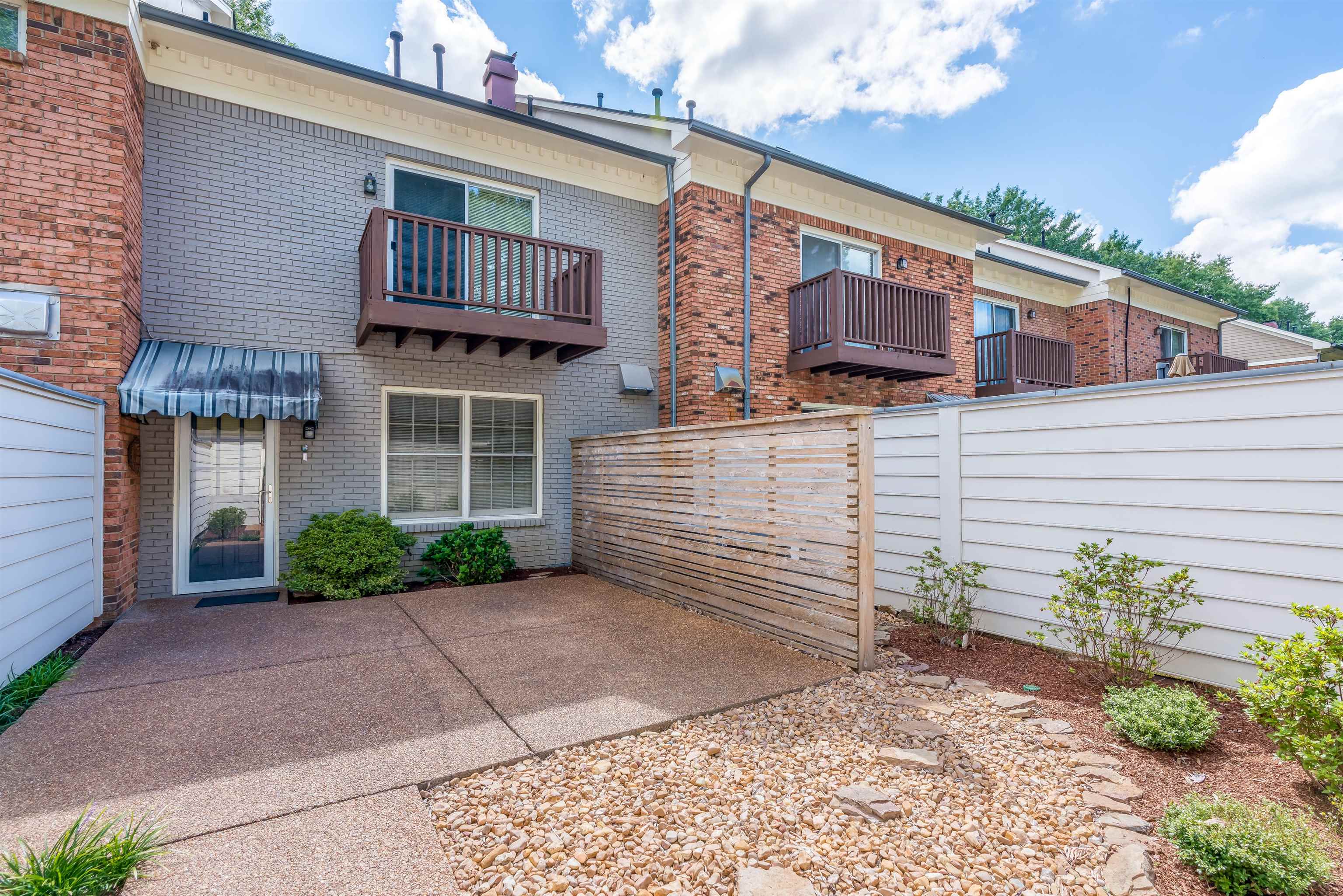 1657 Kimbrough Road, Unit 1657 Germantown, TN 38138 - Photo 22 of 25 a front view of a house with garden