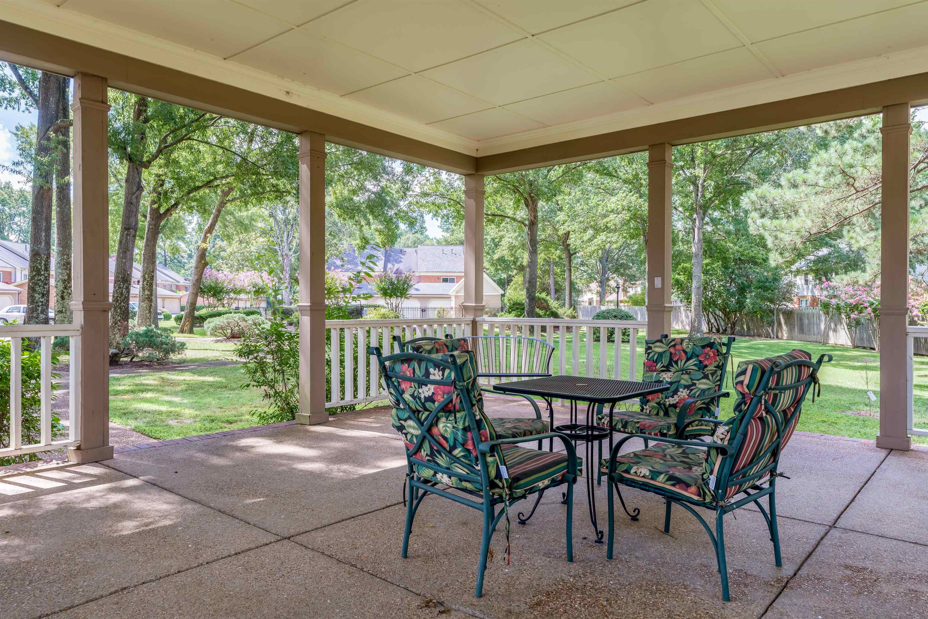 1657 Kimbrough Road, Unit 1657 Germantown, TN 38138 - Photo 24 of 25 a view of a patio with a table chairs and a porch