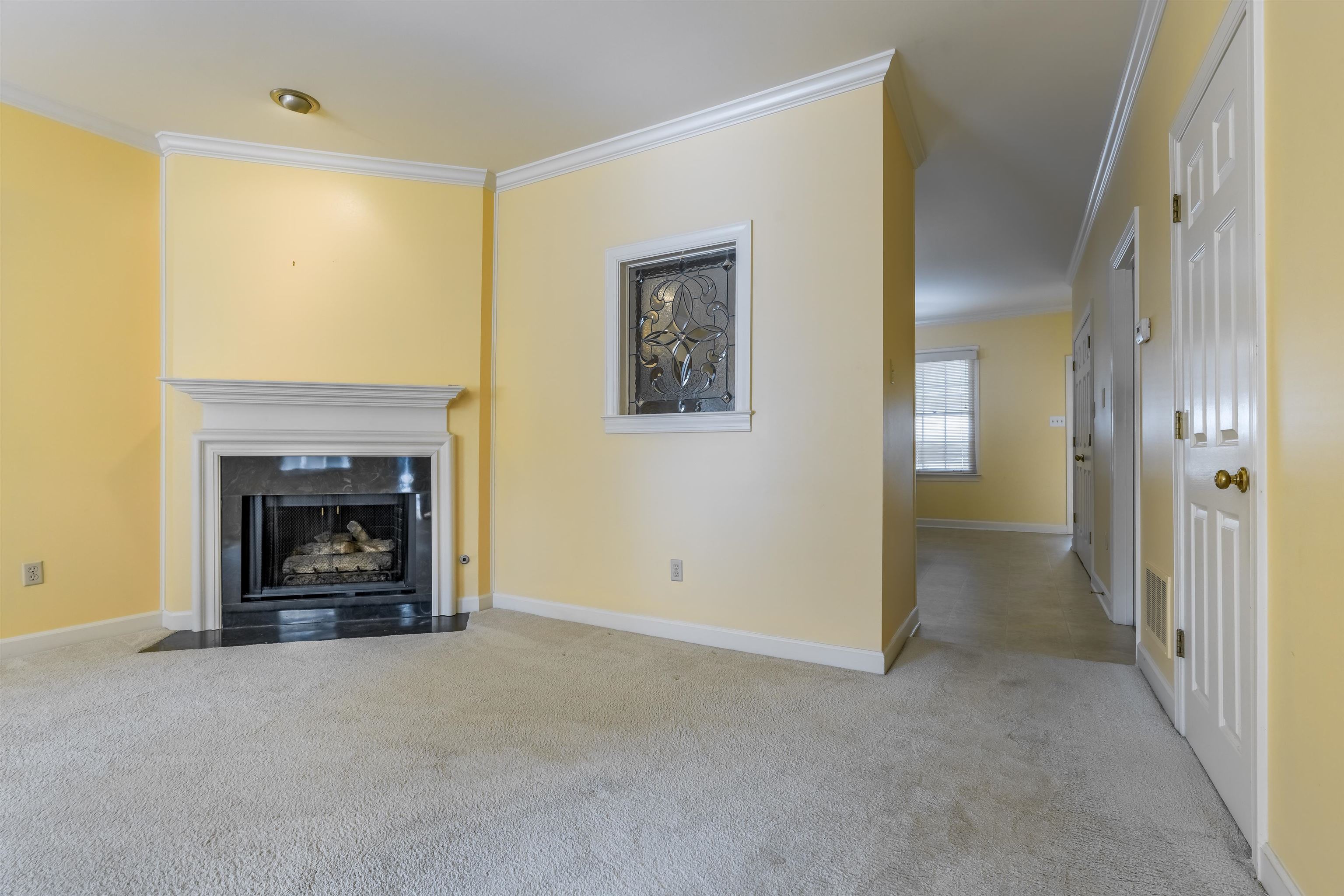 1657 Kimbrough Road, Unit 1657 Germantown, TN 38138 - Photo 6 of 25 a view of a livingroom with a fireplace
