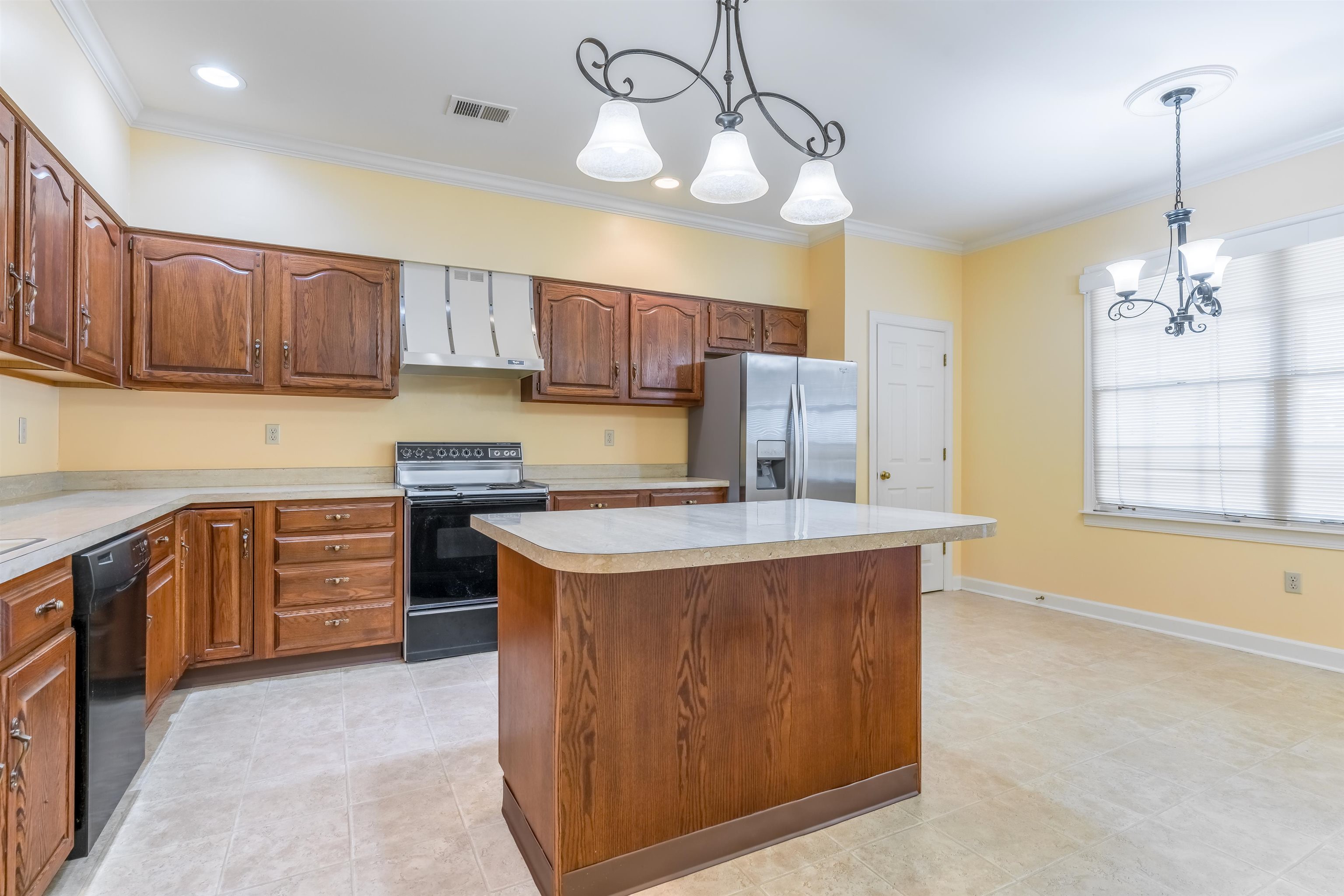 1657 Kimbrough Road, Unit 1657 Germantown, TN 38138 - Photo 8 of 25 a kitchen with kitchen island granite countertop a sink cabinets and window