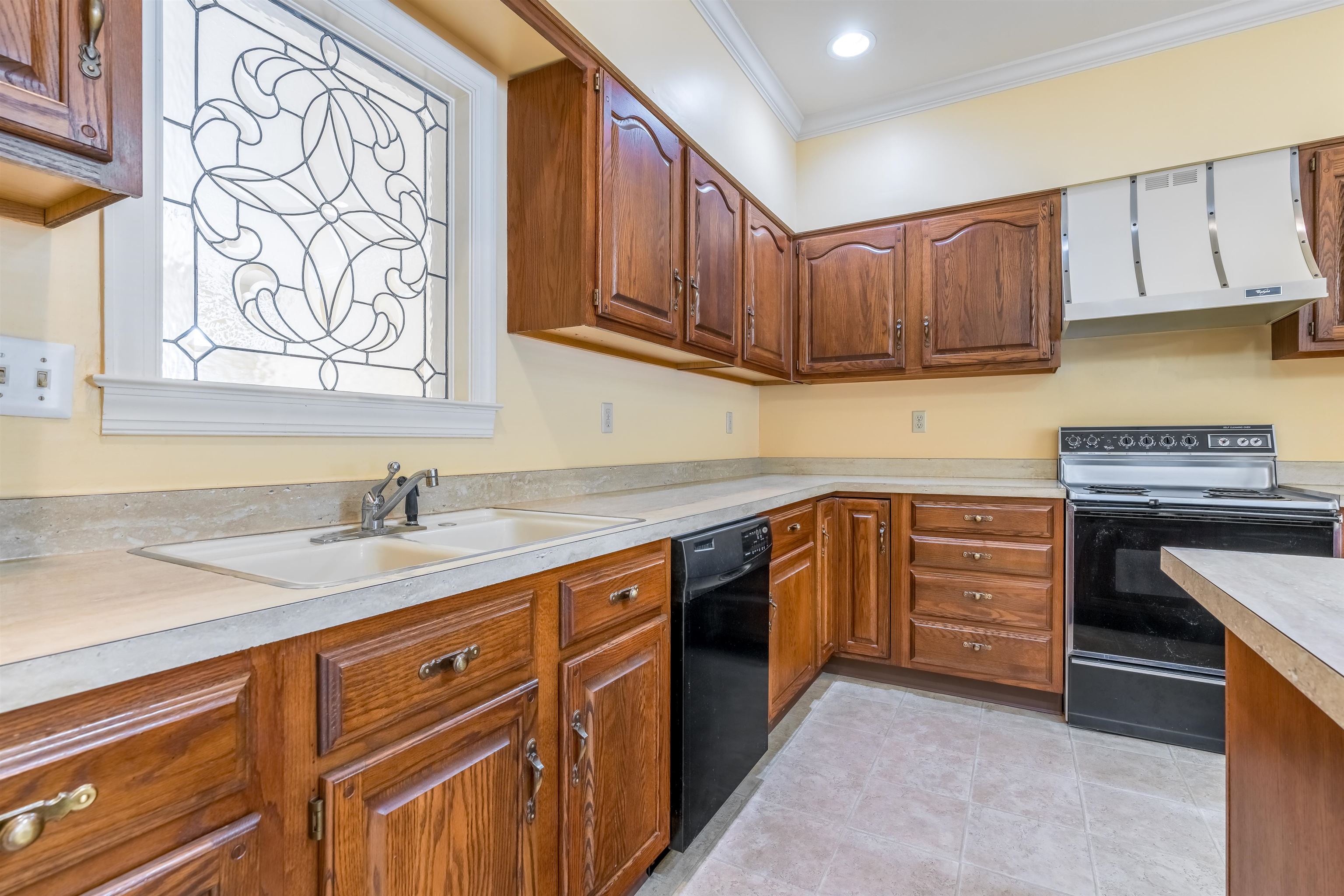 1657 Kimbrough Road, Unit 1657 Germantown, TN 38138 - Photo 9 of 25 a kitchen with stainless steel appliances granite countertop a sink stove and cabinets