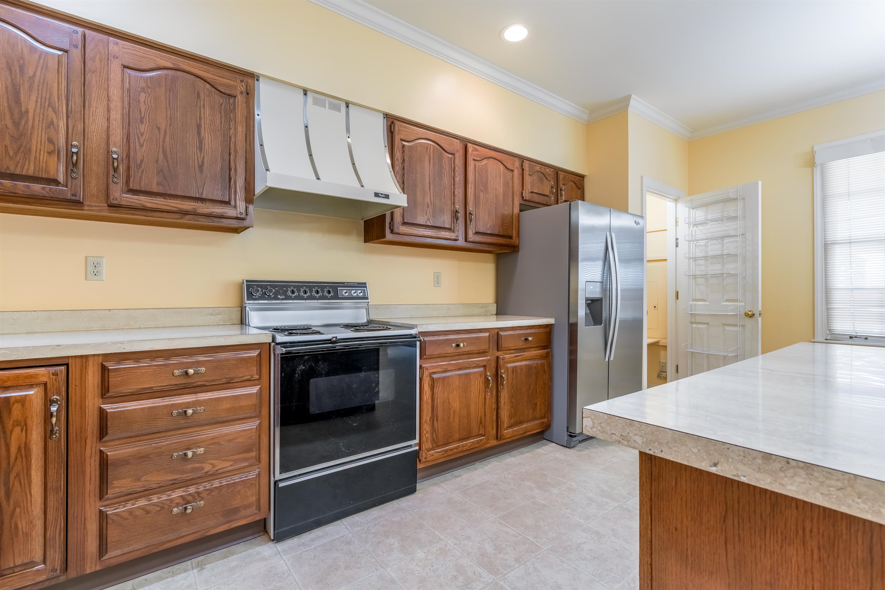 1657 Kimbrough Road, Unit 1657 Germantown, TN 38138 - Photo 10 of 25 a kitchen with stainless steel appliances granite countertop a refrigerator stove and cabinets