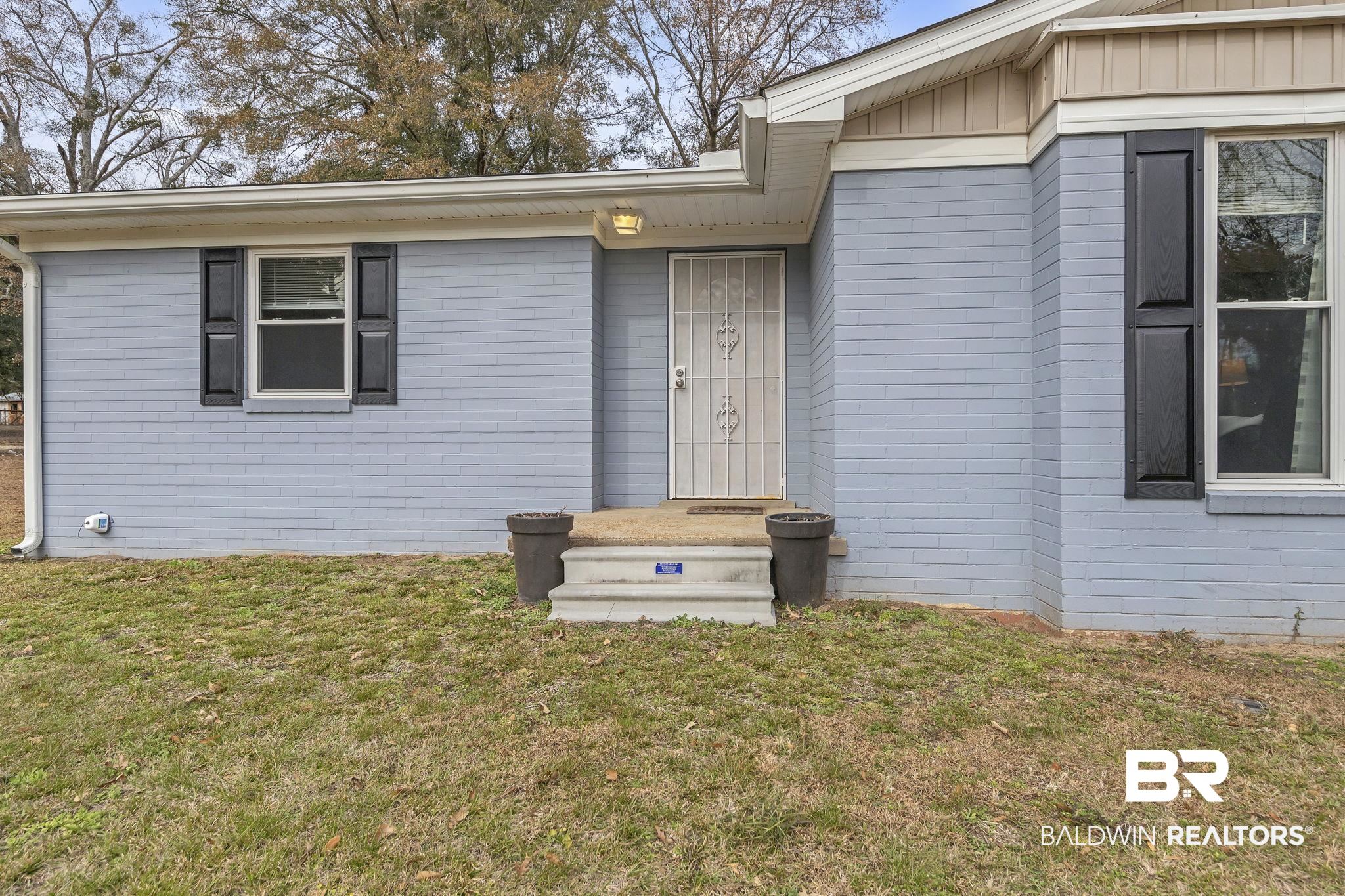 4690 Lott Road Eight Mile, AL 36613 - Photo 12 of 45 Doorway to property with a yard