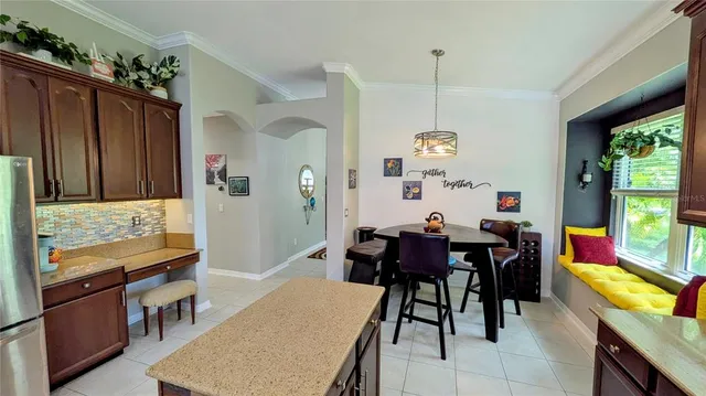 a view of a dining room with furniture window and outside view
