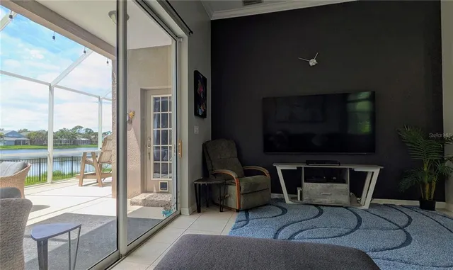 a living room with fireplace furniture and a flat screen tv