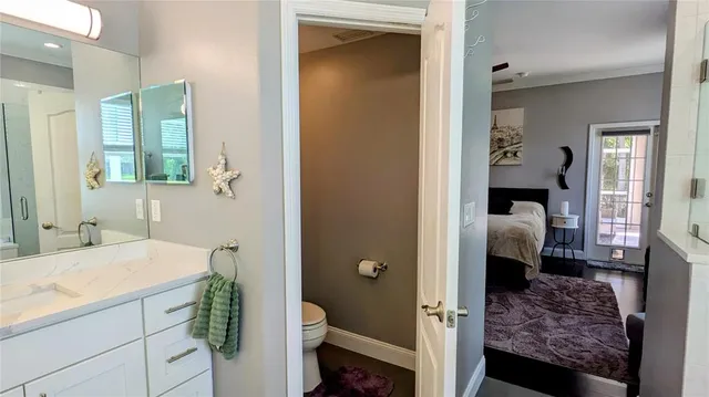 a en suite bathroom with a sink and mirror