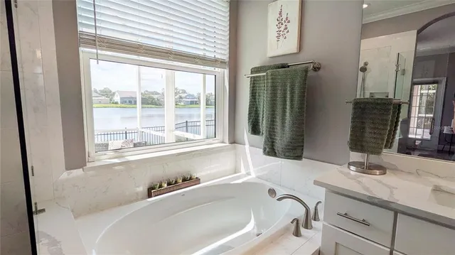 a bathroom with bathtub and a sink