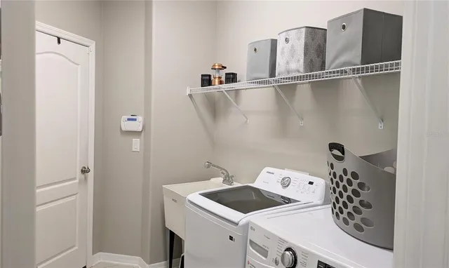 a utility room with dryer and washer